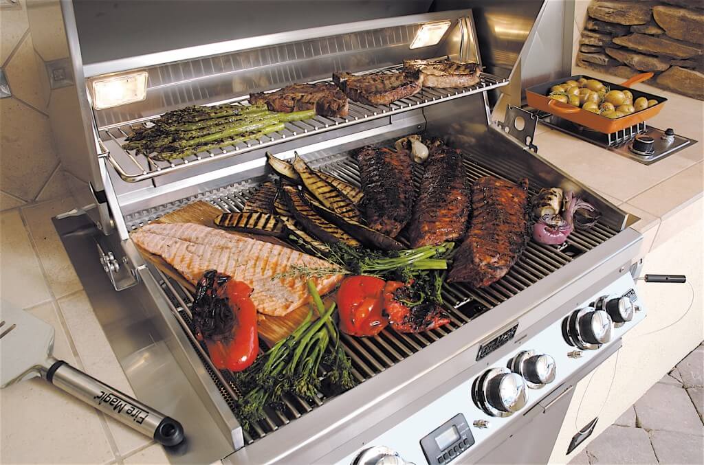 Barbeque grill loaded with healthy fish and vegetables.
